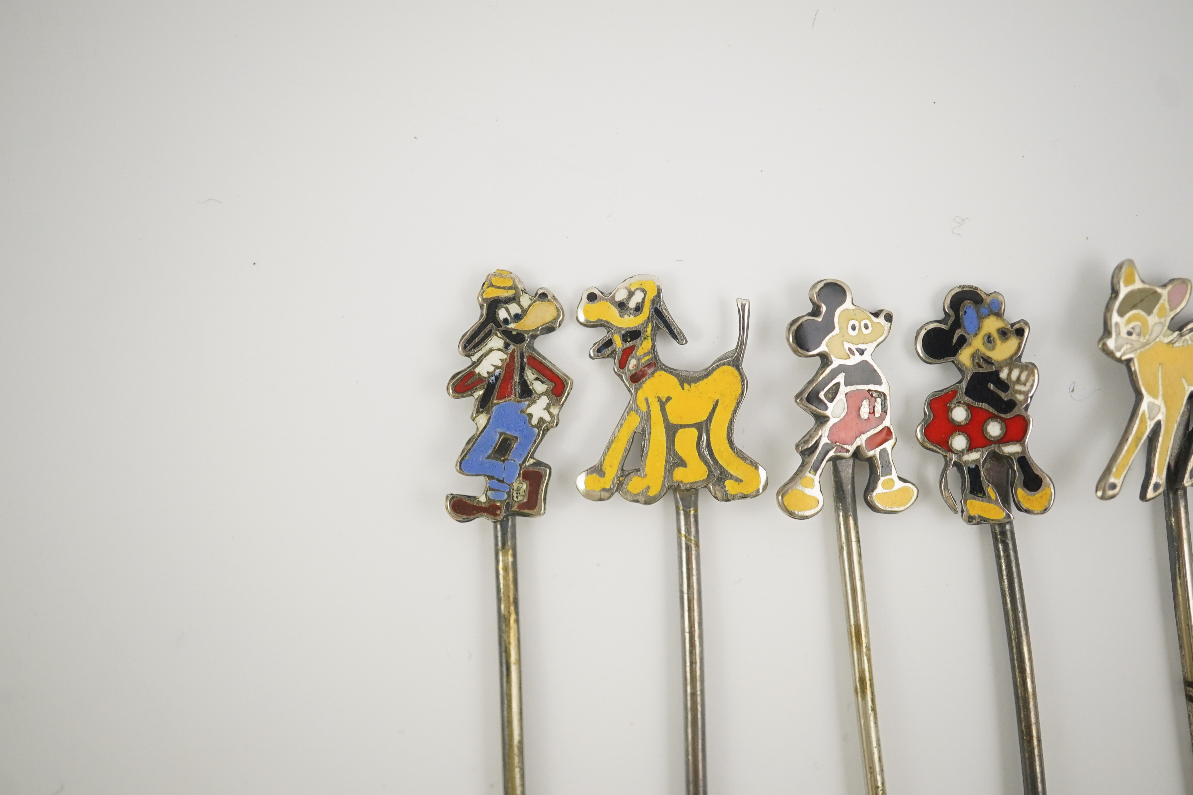 A cased set of six enamelled sterling Disney Character cocktail sticks